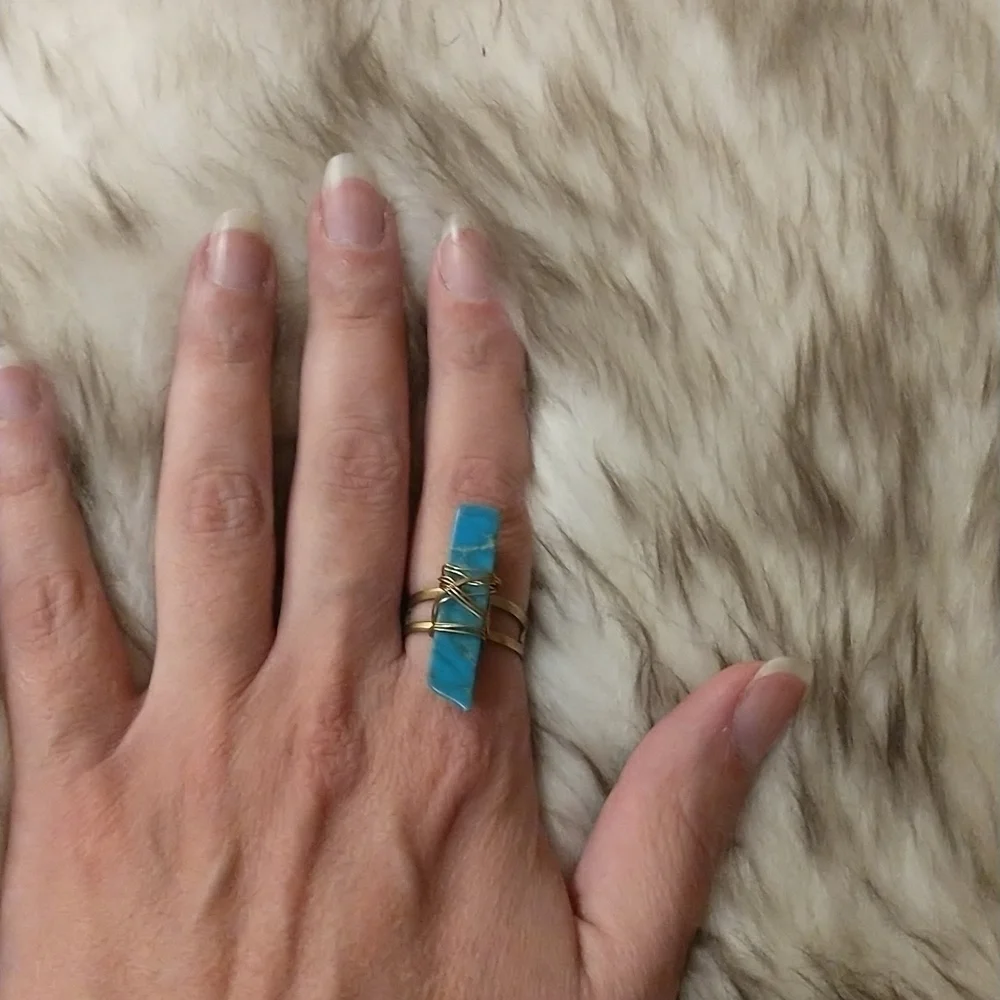 Super cute gold wire wrapped faux turquoise adjustable ring.